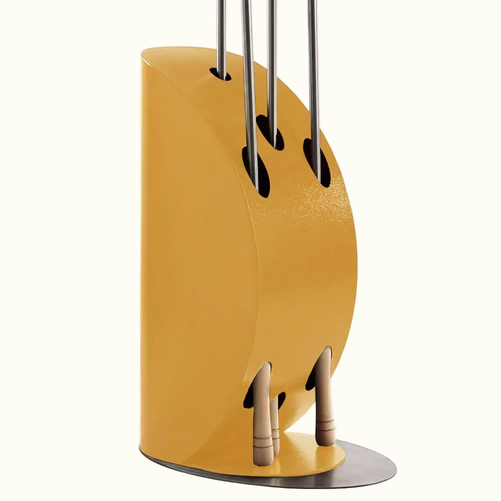 An Imperial Yellow ALFA Vela Peel Holder made of wood, designed to store pizza cooking tools, with a metallic peel and other utensils in it.