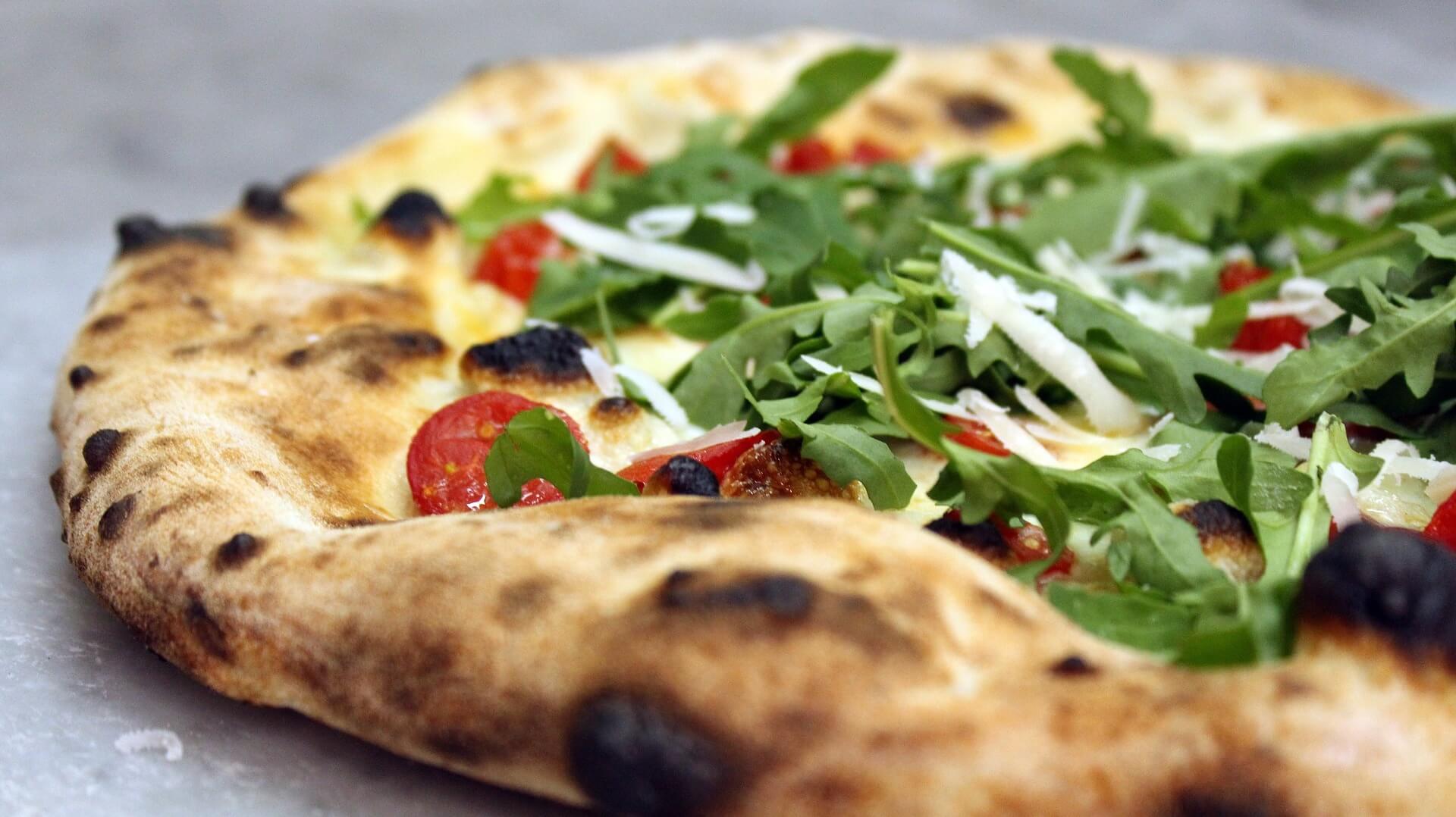 Authentic flatbread restaurant style pizza that was made on a wood fired pizza oven
