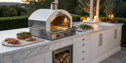 A modern natural gas outdoor pizza oven on a countertop in a backyard patio kitchen.