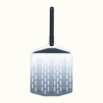 The Ooni 12-Inch Perforated Pizza Peel on an Off-White Background
